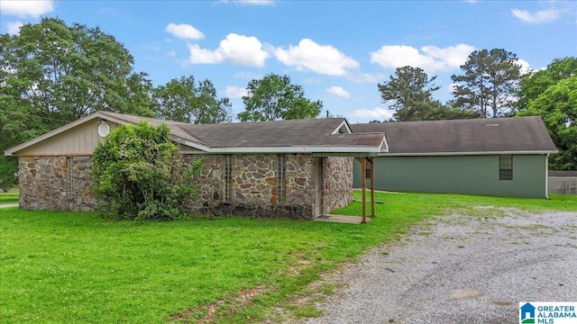 117 Trafford Rd, Warrior, AL 35180 - view of side of home featuring stone siding and a lawn