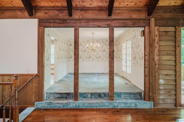 3321 Shetland Trce, Birmingham, AL 35242 - interior space featuring wallpapered walls, beam ceiling, wainscoting, a chandelier, and carpet flooring