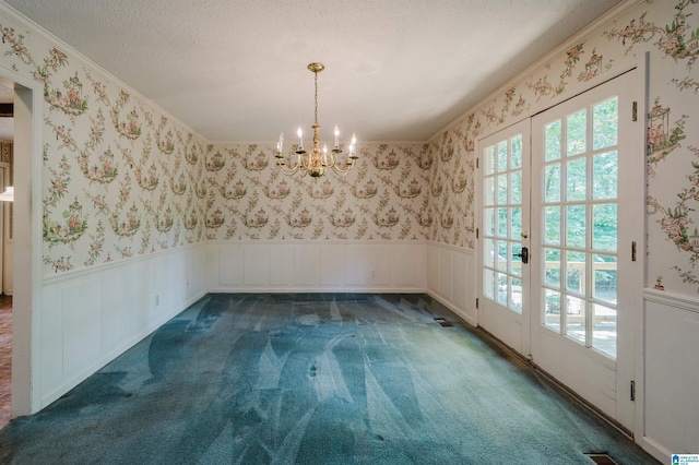 3321 Shetland Trce, Birmingham, AL 35242 - unfurnished dining area featuring a wainscoted wall, a chandelier, carpet floors, wallpapered walls, and crown molding