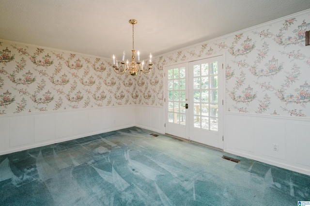 3321 Shetland Trce, Birmingham, AL 35242 - spare room featuring wallpapered walls, ornamental molding, carpet, wainscoting, and a chandelier