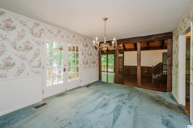 3321 Shetland Trce, Birmingham, AL 35242 - carpeted empty room featuring wallpapered walls, french doors, wainscoting, ornamental molding, and a chandelier