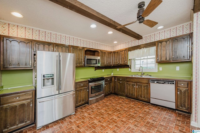 3321 Shetland Trce, Birmingham, AL 35242 - kitchen featuring appliances with stainless steel finishes, a sink, brick patterned floors, a ceiling fan, and a textured ceiling