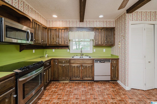 3321 Shetland Trce, Birmingham, AL 35242 - kitchen with stainless steel appliances, a sink, wallpapered walls, brick patterned floors, and a textured ceiling