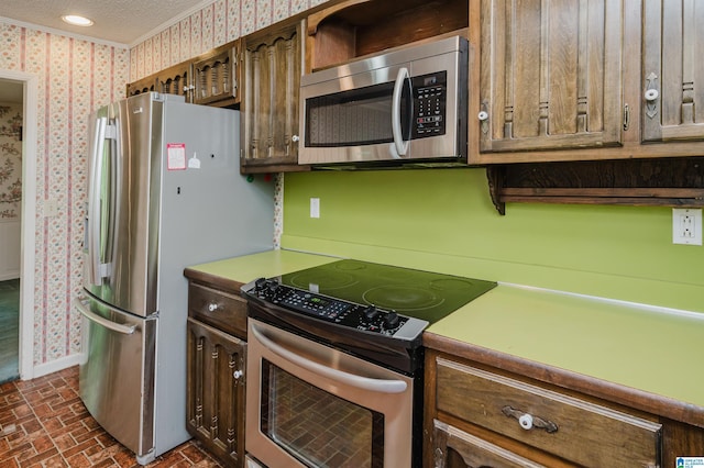 3321 Shetland Trce, Birmingham, AL 35242 - kitchen featuring stainless steel appliances, wallpapered walls, brick patterned floors, crown molding, and baseboards