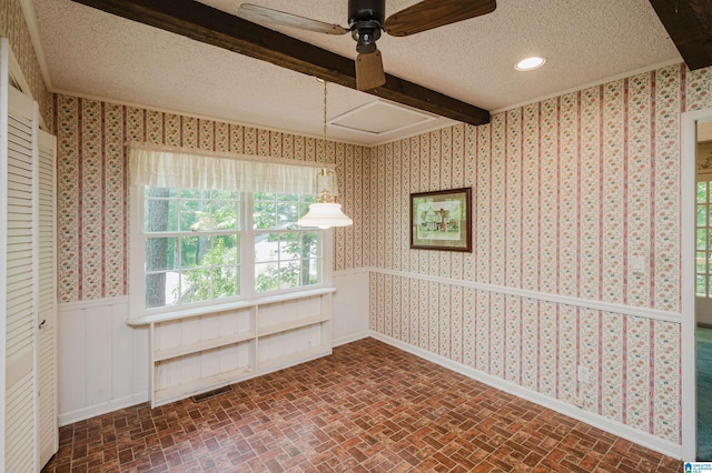 3321 Shetland Trce, Birmingham, AL 35242 - unfurnished room with brick patterned floors, a ceiling fan, beam ceiling, a textured ceiling, and wallpapered walls