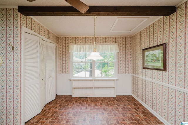 3321 Shetland Trce, Birmingham, AL 35242 - unfurnished dining area with brick patterned flooring, beam ceiling, and wallpapered walls