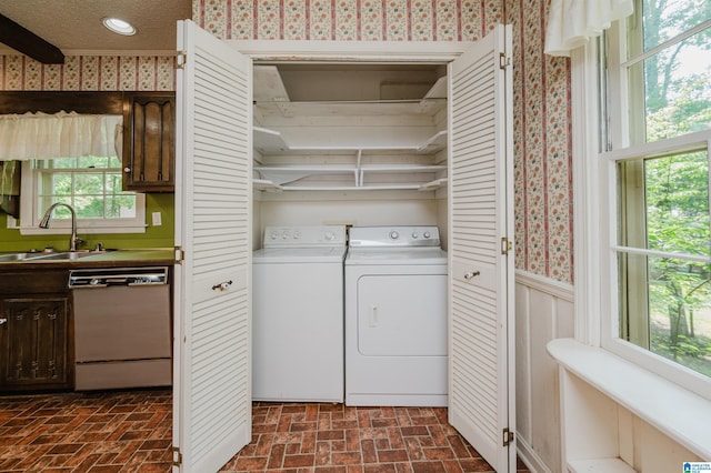 3321 Shetland Trce, Birmingham, AL 35242 - washroom with independent washer and dryer, wallpapered walls, brick patterned flooring, and wainscoting