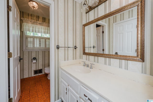 3321 Shetland Trce, Birmingham, AL 35242 - bathroom featuring wallpapered walls, vanity, and toilet