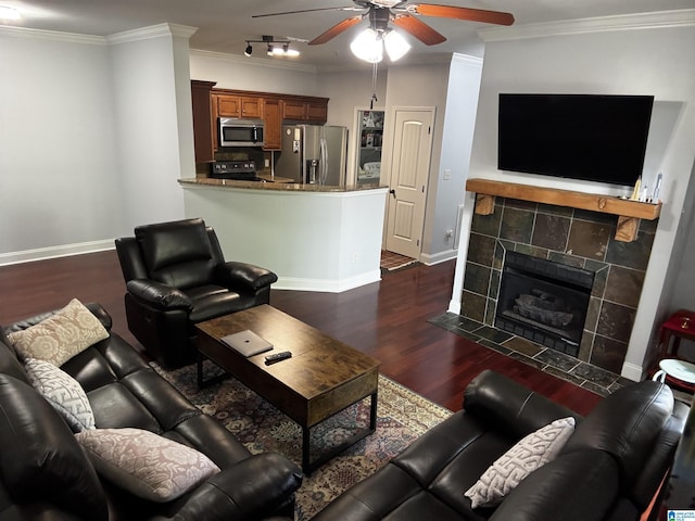 312 Riverhaven Pl Unit 312, Hoover, AL 35244 - living room featuring ceiling fan, dark wood-type flooring, baseboards, ornamental molding, and a tiled fireplace