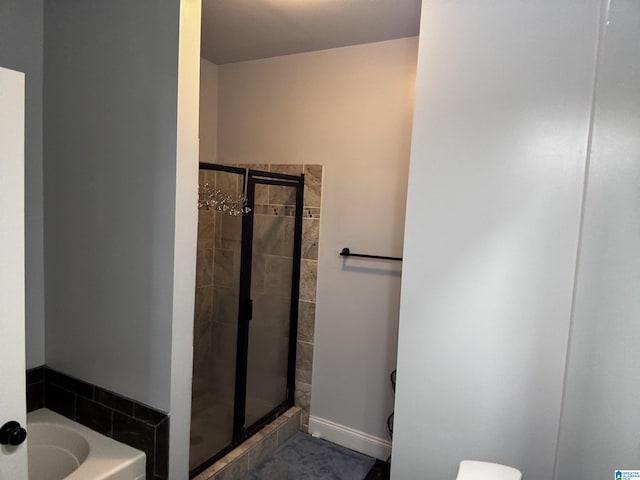 312 Riverhaven Pl Unit 312, Hoover, AL 35244 - bathroom featuring a shower stall, a bath, and toilet
