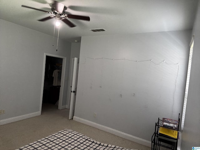 312 Riverhaven Pl Unit 312, Hoover, AL 35244 - unfurnished bedroom featuring light colored carpet, a walk in closet, baseboards, and a closet