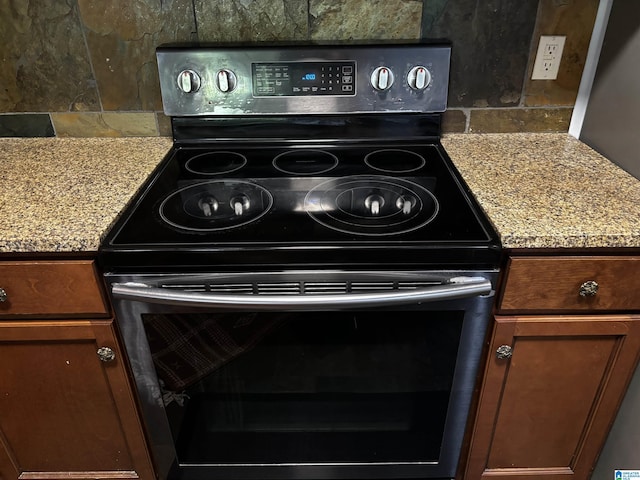 312 Riverhaven Pl Unit 312, Hoover, AL 35244 - kitchen view of electric stove, decorative backsplash, and light countertops