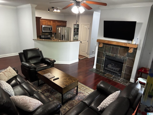 312 Riverhaven Pl Unit 312, Hoover, AL 35244 - living room with ceiling fan, dark wood finished floors, baseboards, ornamental molding, and a tiled fireplace