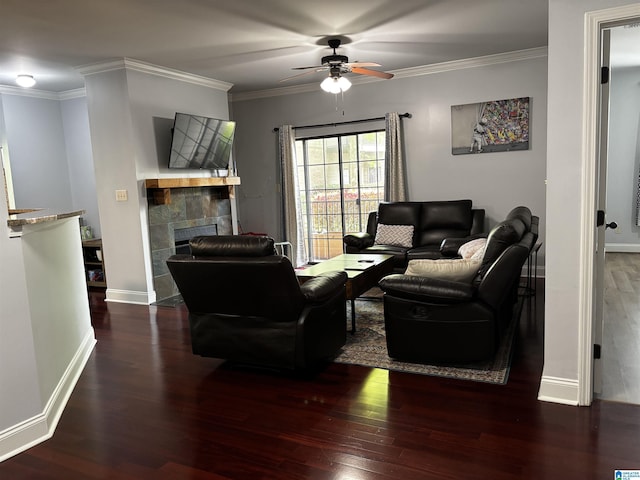 312 Riverhaven Pl Unit 312, Hoover, AL 35244 - living room featuring wood finished floors, a tile fireplace, a ceiling fan, crown molding, and baseboards