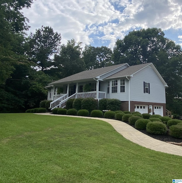 13634 Lisa Dr, Lake View, AL 35111 - view of front of house with a garage, a front lawn, and a porch