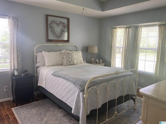 13634 Lisa Dr, Lake View, AL 35111 - bedroom with dark wood-style flooring, multiple windows, and baseboards