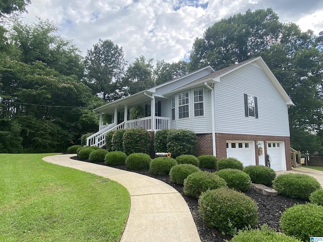 13634 Lisa Dr, Lake View, AL 35111 - view of side of property featuring an attached garage, a yard, brick siding, and concrete driveway