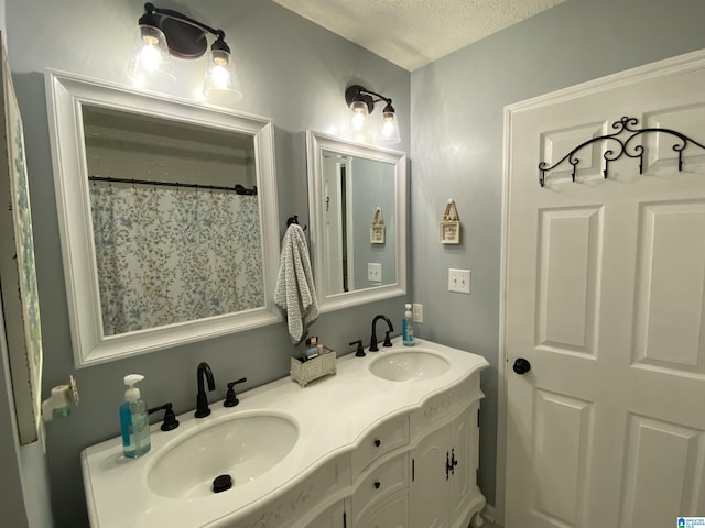 13634 Lisa Dr, Lake View, AL 35111 - bathroom featuring a textured ceiling and double vanity