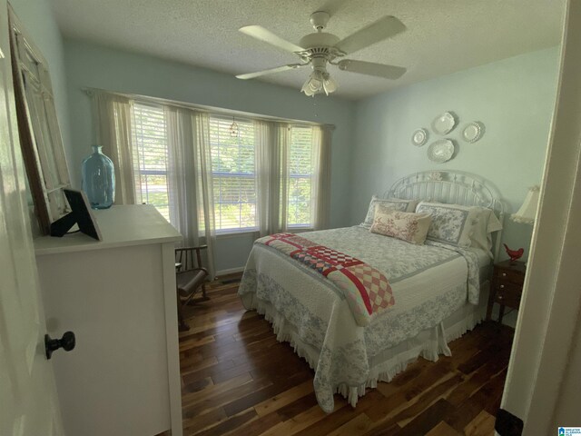 13634 Lisa Dr, Lake View, AL 35111 - bedroom featuring dark wood-style floors, a textured ceiling, and ceiling fan