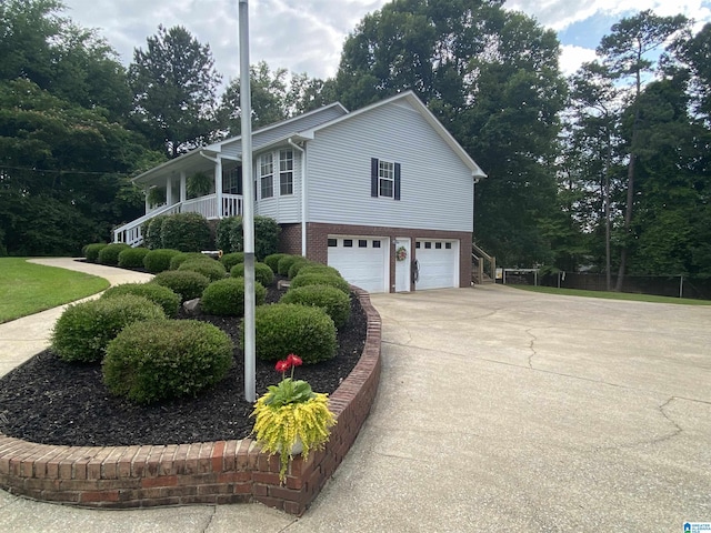 13634 Lisa Dr, Lake View, AL 35111 - view of side of home with a garage, driveway, and brick siding