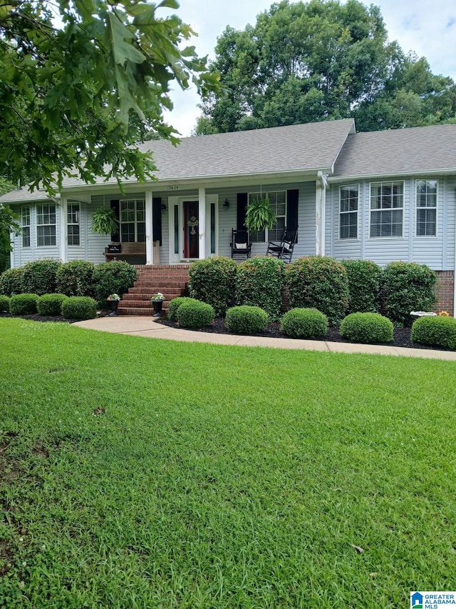 13634 Lisa Dr, Lake View, AL 35111 - single story home featuring a porch, a front lawn, and roof with shingles