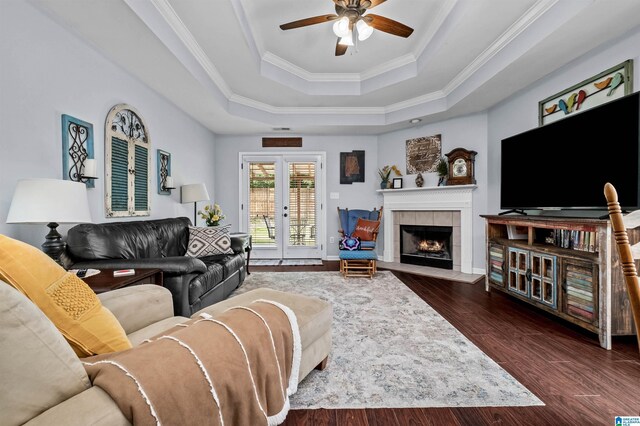 347 Forest Lakes Dr, Sterrett, AL 35147 - living room with a raised ceiling, crown molding, a ceiling fan, dark wood finished floors, and a fireplace