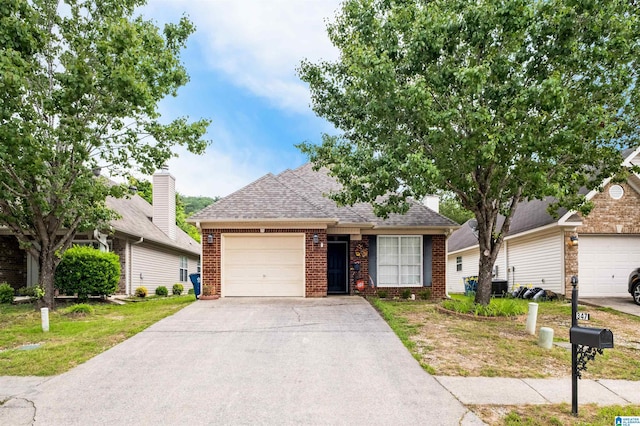 347 Forest Lakes Dr, Sterrett, AL 35147 - view of front of property with brick siding, a garage, and concrete driveway