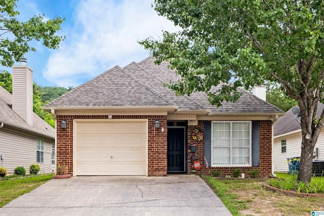 347 Forest Lakes Dr, Sterrett, AL 35147 - view of front of house with brick siding, an attached garage, a shingled roof, and driveway