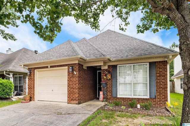 347 Forest Lakes Dr, Sterrett, AL 35147 - view of front of house featuring an attached garage, a shingled roof, brick siding, and driveway
