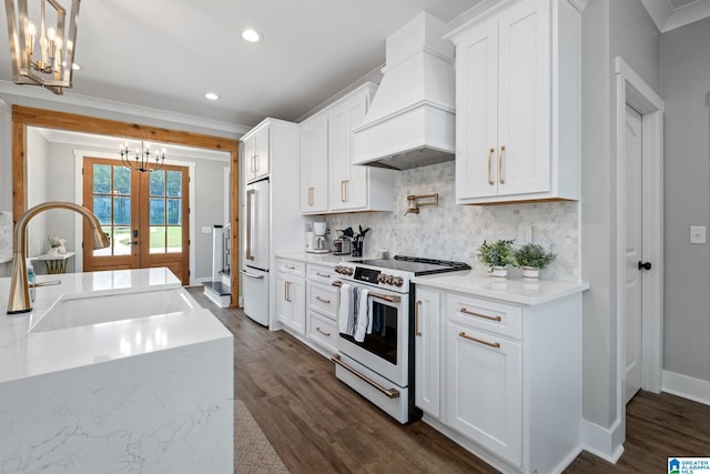 1165 Cedar Creek Dr, Sylacauga, AL 35151 - kitchen featuring white appliances, custom exhaust hood, a sink, a chandelier, and decorative backsplash