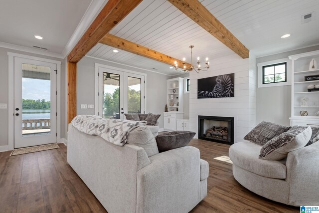 1165 Cedar Creek Dr, Sylacauga, AL 35151 - living area with dark wood finished floors, beamed ceiling, a chandelier, a fireplace, and recessed lighting