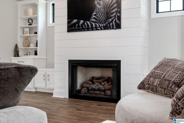 1165 Cedar Creek Dr, Sylacauga, AL 35151 - living area with wood finished floors and a fireplace