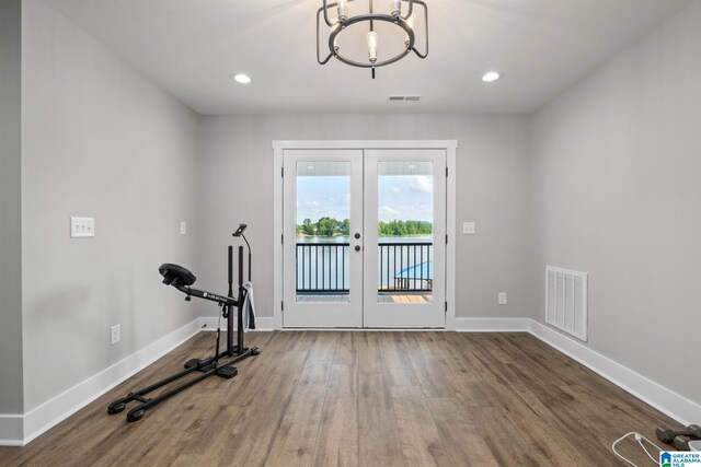 1165 Cedar Creek Dr, Sylacauga, AL 35151 - exercise room featuring french doors, wood finished floors, a chandelier, baseboards, and recessed lighting