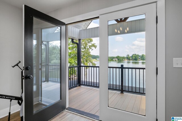 1165 Cedar Creek Dr, Sylacauga, AL 35151 - doorway to outside featuring a water view, wood finished floors, and plenty of natural light