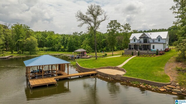 1165 Cedar Creek Dr, Sylacauga, AL 35151 - dock featuring a water view, boat lift, a yard, and a forest view