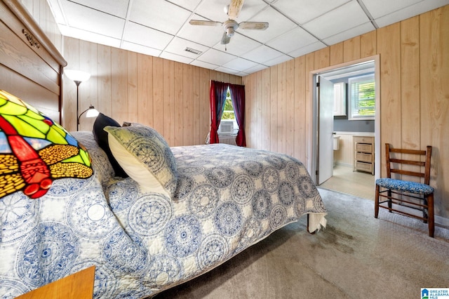 580 3rd St SW, Ashland, AL 36251 - bedroom with carpet, multiple windows, wood walls, a drop ceiling, and ceiling fan