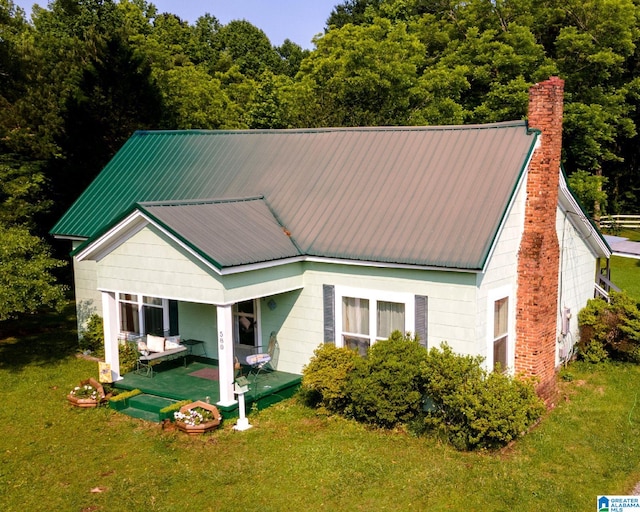 580 3rd St SW, Ashland, AL 36251 - view of front of home featuring a front yard and a chimney