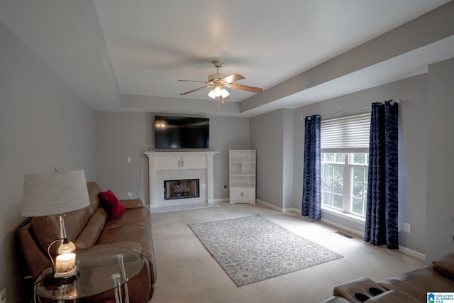 13339 Sylvia Dr, Lake View, AL 35111 - living area with a raised ceiling, light colored carpet, a ceiling fan, and a premium fireplace