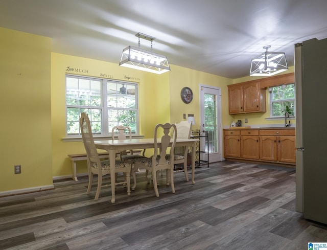13339 Sylvia Dr, Lake View, AL 35111 - dining room with dark wood-style flooring, a chandelier, and baseboards