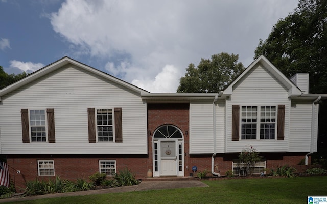 13339 Sylvia Dr, Lake View, AL 35111 - raised ranch featuring brick siding, a front yard, and a chimney