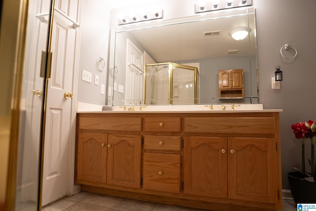 13339 Sylvia Dr, Lake View, AL 35111 - full bathroom with double vanity, a shower stall, and tile patterned floors