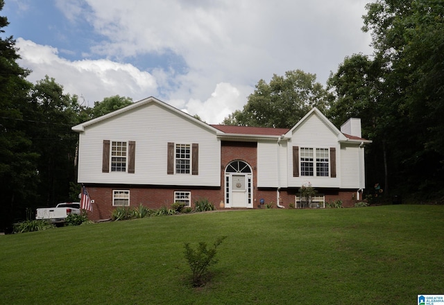 13339 Sylvia Dr, Lake View, AL 35111 - bi-level home with a front yard, a chimney, and brick siding