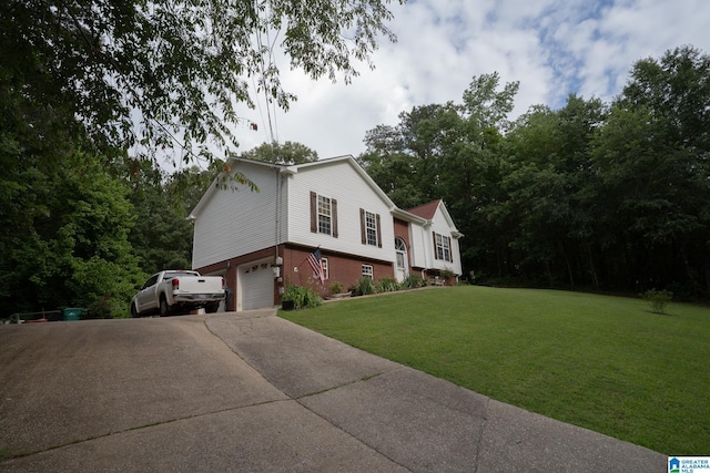 13339 Sylvia Dr, Lake View, AL 35111 - view of property exterior with a garage, a yard, concrete driveway, and brick siding