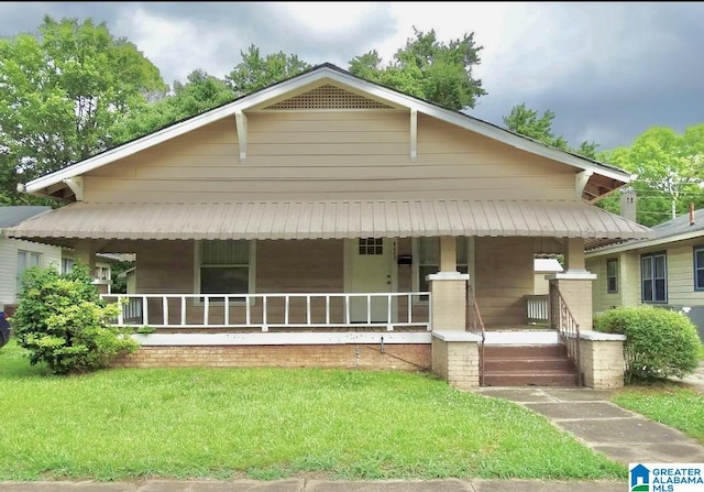 8405 3rd Ave S, Birmingham, AL 35206 - view of front of home with a porch and a front lawn