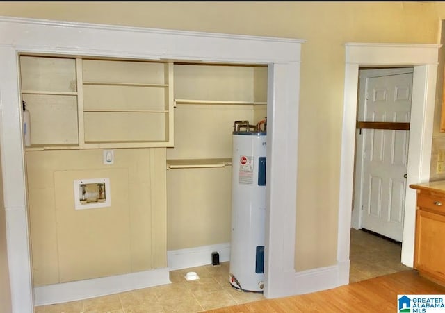 8405 3rd Ave S, Birmingham, AL 35206 - laundry room with electric water heater, washer hookup, baseboards, and light tile patterned flooring