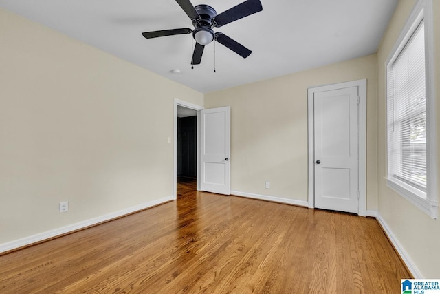 741 Center Pl SW, Birmingham, AL 35211 - unfurnished bedroom with wood finished floors and ceiling fan