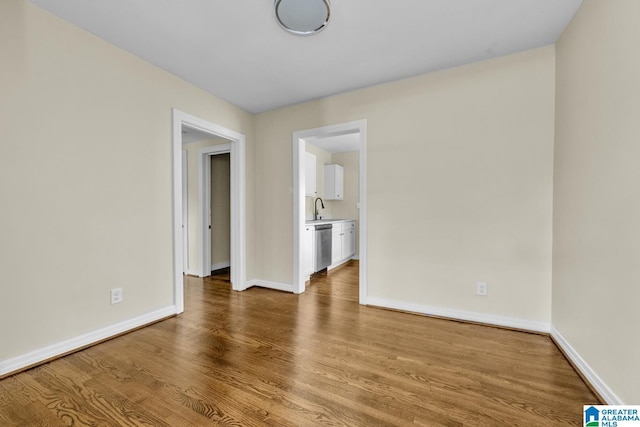 741 Center Pl SW, Birmingham, AL 35211 - spare room with wood finished floors and a sink