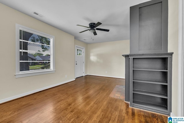741 Center Pl SW, Birmingham, AL 35211 - unfurnished living room featuring wood finished floors and a ceiling fan