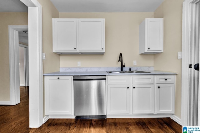 741 Center Pl SW, Birmingham, AL 35211 - kitchen with stainless steel dishwasher, white cabinets, light countertops, and dark wood-style floors