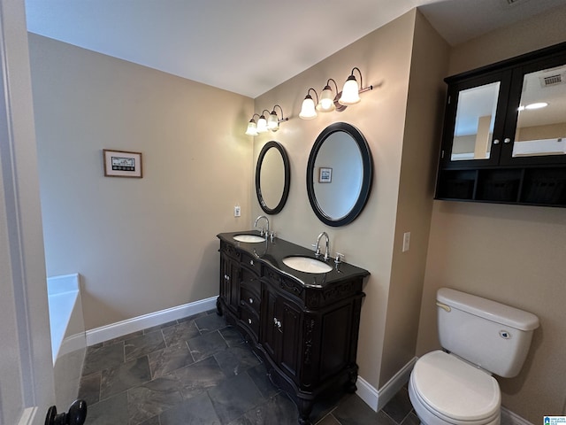 21131 Delmar Dr, Lake View, AL 35111 - full bath with double vanity, stone finish floors, and a tub